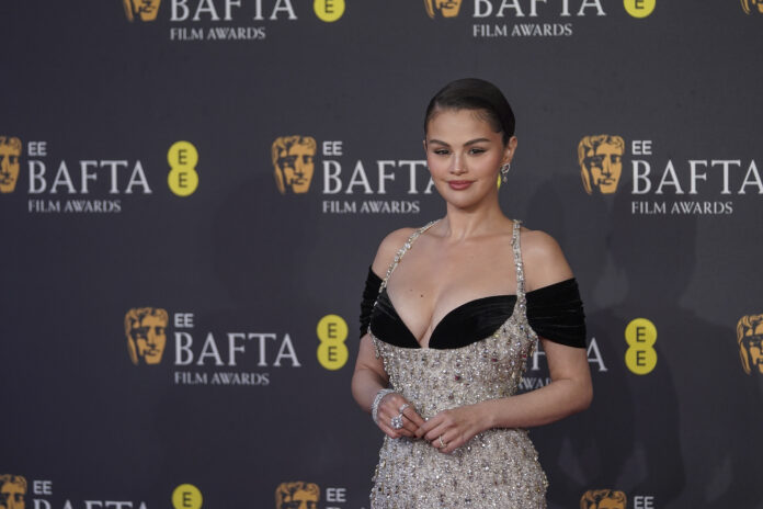 Selena Gomez poses for photographers upon arrival at the 78th British Academy Film Awards, BAFTA's, in London, Sunday, Feb. 16, 2025. (Photo by Joel C Ryan/Invision/AP)