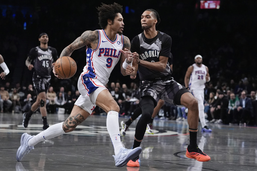 Russell contributes 22 points in Nets’ 100-96 victory over 76ers