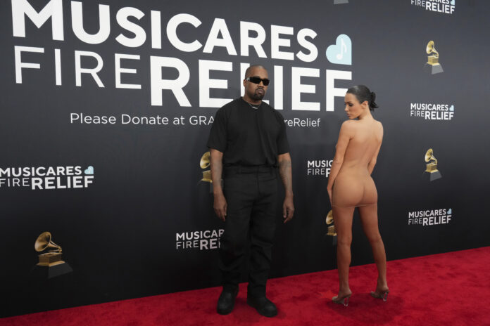 Kanye West, left, and Bianca Censori arrive at the 67th annual Grammy Awards on Sunday, Feb. 2, 2025, in Los Angeles. (Photo by Jordan Strauss/Invision/AP)