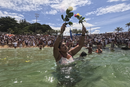 Worshippers honor Afro-Brazilian ocean deity at beach in Rio de Janeiro