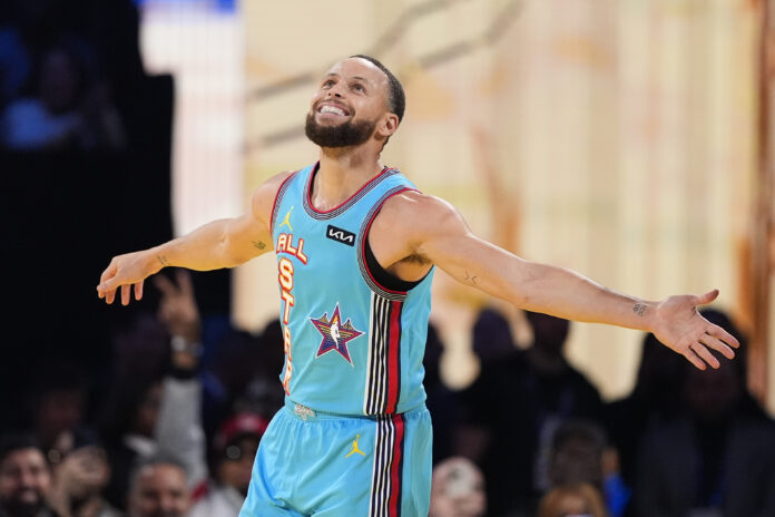 Golden State Warriors guard Stephen Curry celebrates after scoring during the NBA All-Star basketball game Sunday, Feb. 16, 2025, in San Francisco. (AP Photo/Godofredo A. Vásquez)