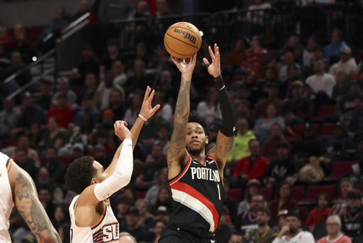 Deandre Ayton guides Trail Blazers to 127-108 win against Suns in first match of two-game series.