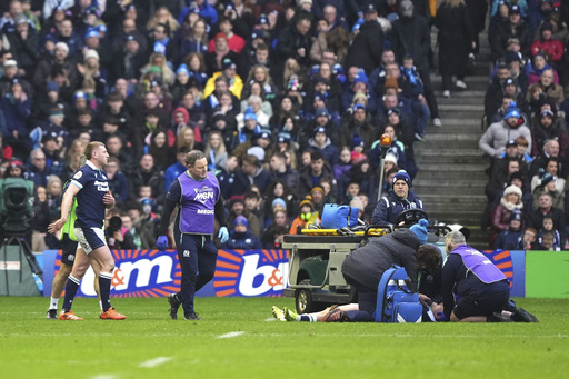 Scotland rugby players Darcy Graham and Finn Russell experience severe head collision during Six Nations match.