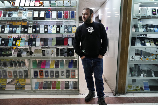 Iran relaxes restrictions on foreign vehicle and iPhone imports in an attempt to disguise its economic challenges.