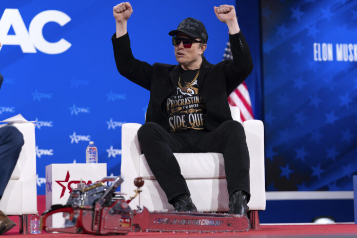 Elon Musk gestures during the Conservative Political Action Conference, CPAC, at the Gaylord National Resort & Convention Center, Thursday, Feb. 20, 2025, in Oxon Hill, Md. (AP Photo/Jose Luis Magana)