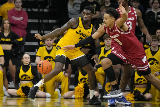 Ranked 21st, Wisconsin extends their winning streak to three games by defeating Iowa 74-63.