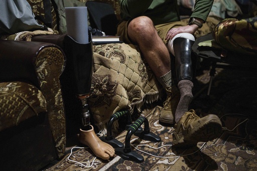 Maksym Vysotskyi, a drone unit commander with Ukraine's 82nd assault brigade, sits on a sofa near the front line in Ukraine's Kharkiv region on Feb. 2, 2025. (AP Photo/Evgeniy Maloletka)