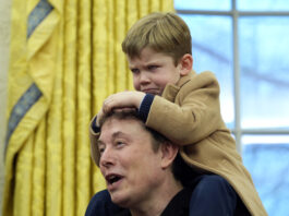 Elon Musk, joined by his son X Æ A-Xii, speaks during an event with President Donald Trump in the Oval Office at the White House, Tuesday, Feb. 11, 2025, in Washington. (Photo/Alex Brandon)