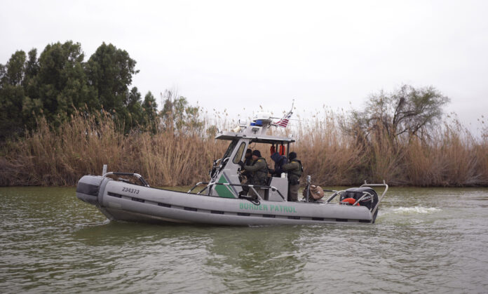 Border patrol agents patrol along the Rio Grande at the U.S.-Texas border, Thursday, Feb. 13, 2025, in McAllen, Texas. (AP Photo/Eric Gay)