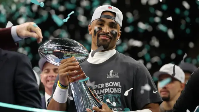 NEW ORLEANS, LOUISIANA – FEBRUARY 09: Jalen Hurts #1 of the Philadelphia Eagles celebrates with the Vince Lombardi Trophy after defeating the Kansas City Chiefs 40-22 to win Super Bowl LIX at Caesars Superdome on February 09, 2025 in New Orleans, Louisiana. (Photo by Jamie Squire/Getty Images)