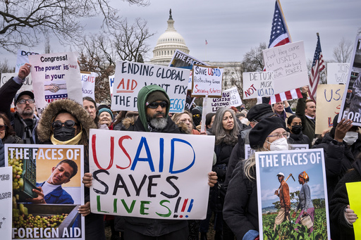 Demonstrators and lawmakers rally against President Donald Trump and his ally Elon Musk as they disrupt the federal government, including dismantling the U.S. Agency for International Development, which administers foreign aid approved by Congress, on Capitol Hill in Washington, Wednesday, Feb. 5, 2025. (AP Photo/J. Scott Applewhite)