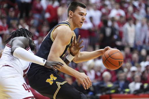 Danny Wolf leads No. 24 Michigan to a 70-67 victory over a relentless Indiana, marking their fourth consecutive win.