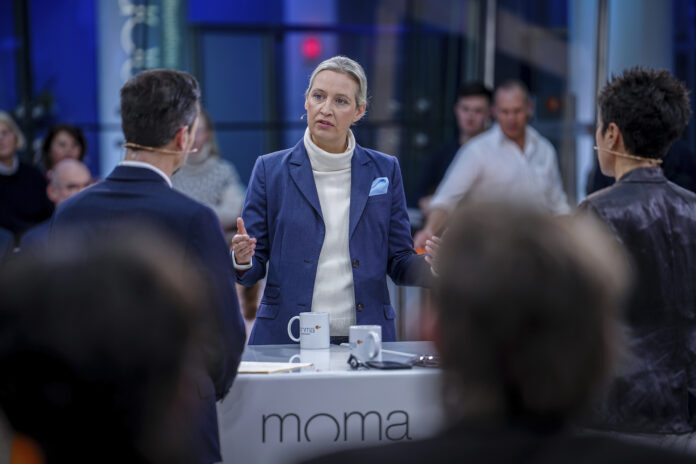 Candidate for chancellor and leader of the AfD (Alternative for Germany) parliamentary group, Alice Weidel talks to presenters Andreas Wunn and Dunja Hayali, right, in an interview on the ZDF morning show 