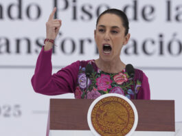 FILE - President Claudia Sheinbaum speaks to the crowd during an event marking her first 100 days in office, at the Zócalo, Mexico City's main square, in Mexico City, Sunday, Jan. 12, 2025. (AP Photo/Fernando Llano, File)