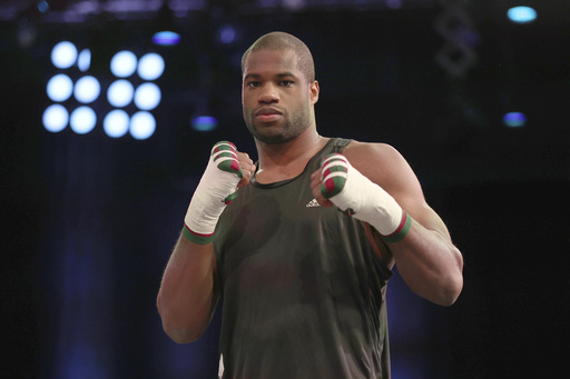 Champion Daniel Dubois faces medical evaluation, casting uncertainty on heavyweight match.