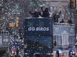 Players and coaches celebrate during the Philadelphia Eagles' NFL football Super Bowl 59 parade and celebration, Friday, Feb. 14, 2025, in Philadelphia. (AP Photo/Matt Slocum)