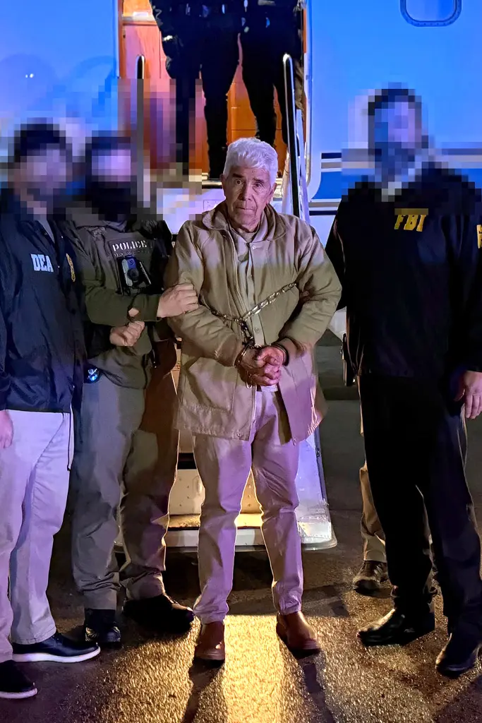 Quintero as he’s led off a plane by DEA agents on Thursday night.