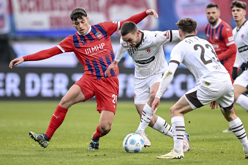 US midfielder James Sands sustains severe ankle injury and fractured calf bone while competing for St. Pauli.