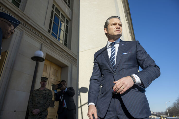 Defense Secretary Pete Hegseth arrives at the Pentagon, Monday, Jan. 27, 2025 in Washington. (AP Photo/Kevin Wolf)