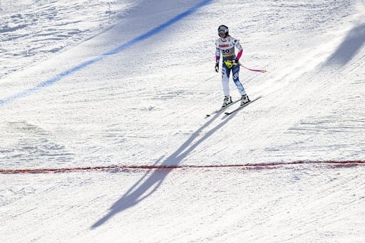 Austrian athlete Stephanie Venier secures victory in the women’s super-G event at the world championships, while Vonn encounters a gate issue and does not finish.