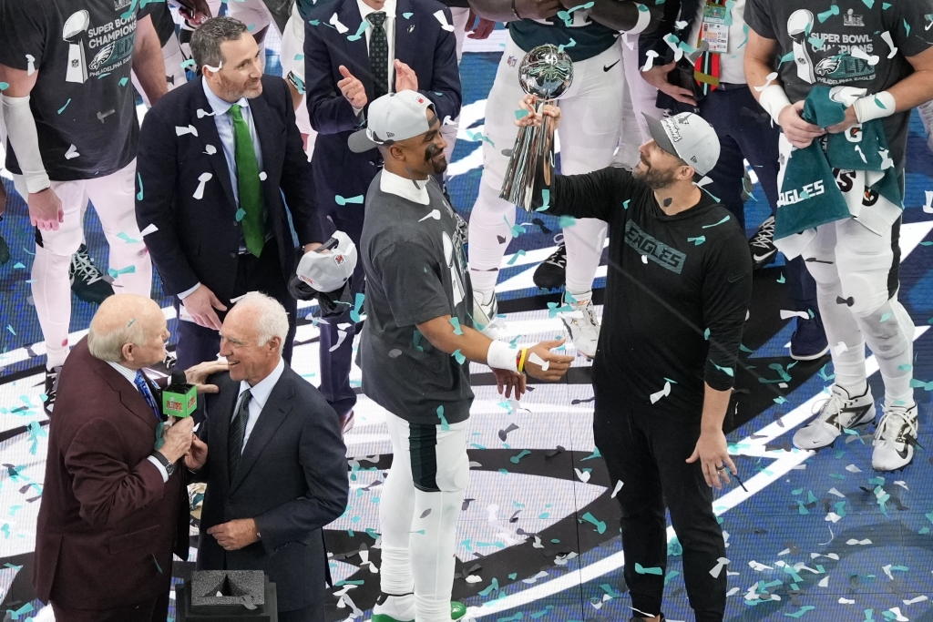 Philadelphia Eagles head coach Nick Sirianni, right, lifts the Vince Lombardi Trophy next to quarterback Jalen Hurts after defeating the Kansas City Chiefs in the NFL Super Bowl 59 football game, Sunday, Feb. 9, 2025, in New Orleans. (AP Photo/Matt Slocum)