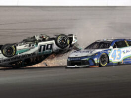 Ryan Preece (60) flips upside down as he crashes going in to turn 3 as Erik Jones (43) goes past during the NASCAR Daytona 500 auto race at Daytona International Speedway, Sunday, Feb. 16, 2025, in Daytona Beach, Fla. (AP Photo/Mike Troxell)