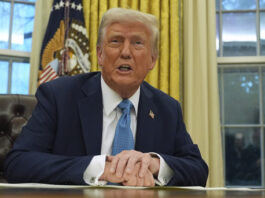 President Donald Trump speaks to reporters as he signs executive orders in the Oval Office of the White House, Friday, Jan. 31, 2025, in Washington. (AP Photo/Evan Vucci)