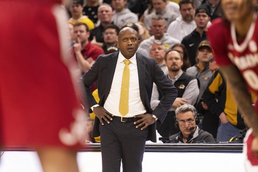 Missouri’s Dennis Gates uses PA system to prevent court-storming after game.