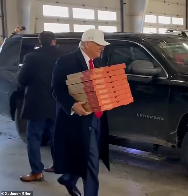 Trump was seen dragging his leg in January 2024 as he delivered pizza to firefighters before the Iowa caucuses. Experts have now suggested he may be exhibiting a 'knock knee' - a condition in which both knees bend inward

