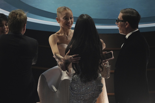 Ariana Grande, left, and Demi Moore in the audience during the Oscars on Sunday, March 2, 2025, at the Dolby Theatre in Los Angeles. (AP Photo/Chris Pizzello)