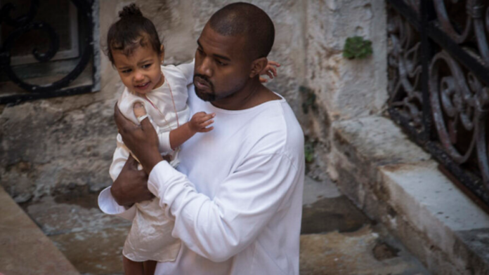 Singer Kanye West with his daughter North as they leave the Saint James Armenian Church in Jerusalem’s Armenian Quarter in April 2015. Photo by Hadas Parush/Flash90.